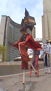 Clay & Paper Theatre performs the March of the Stilted Buildings at City Hall